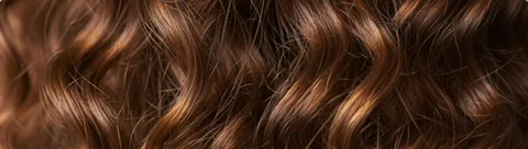 Loose brown curls, close up
